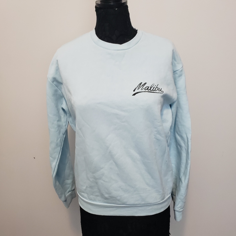 Malibu Women's Crewneck Sweatshirt Size Large 
Fits more like a medium